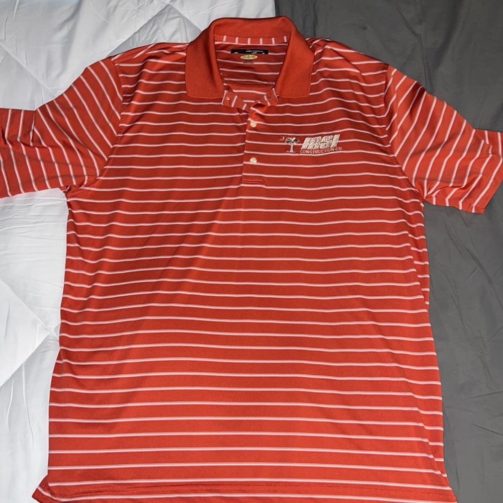 2 Men’s XL Greg Norman Play Dry polo shirt.